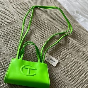 Small highlighter green Telfar bag.